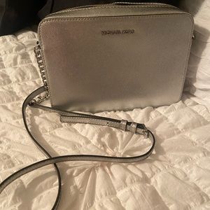 Silver Micheal Kors crossbody No stains or tears